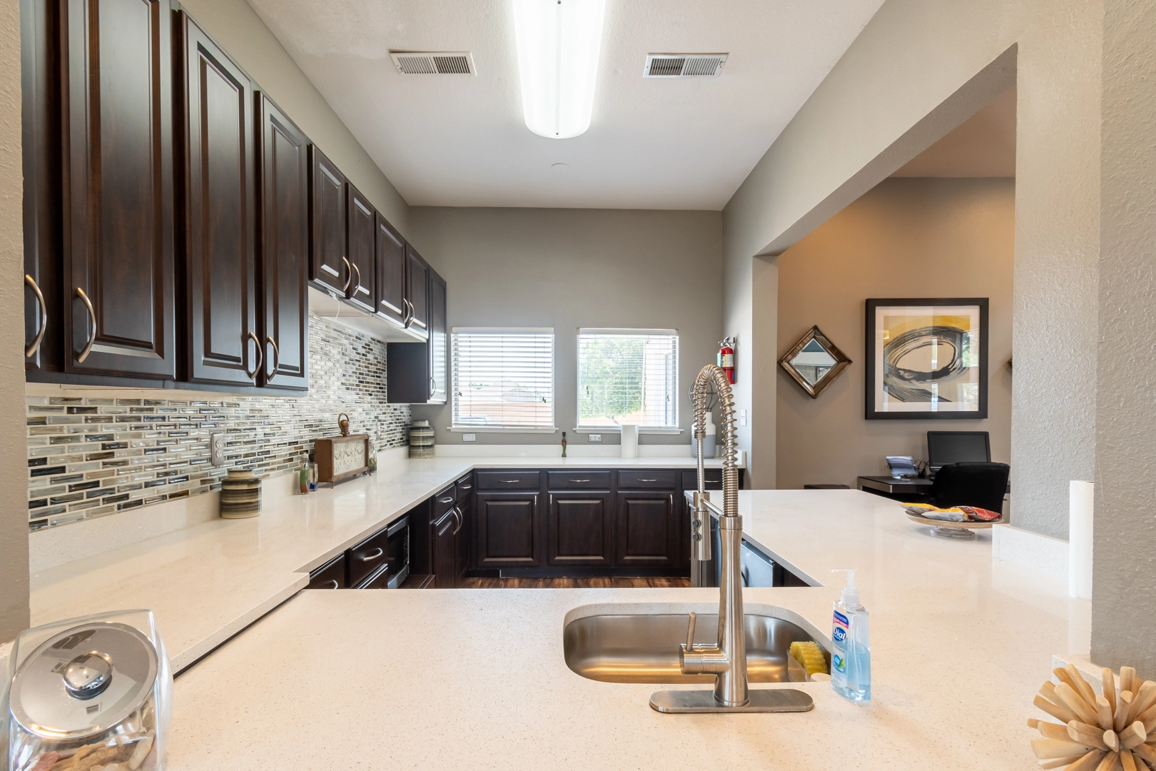 Second view of an apartment kitchen with full range appliances at Western Station at Fossil Creek