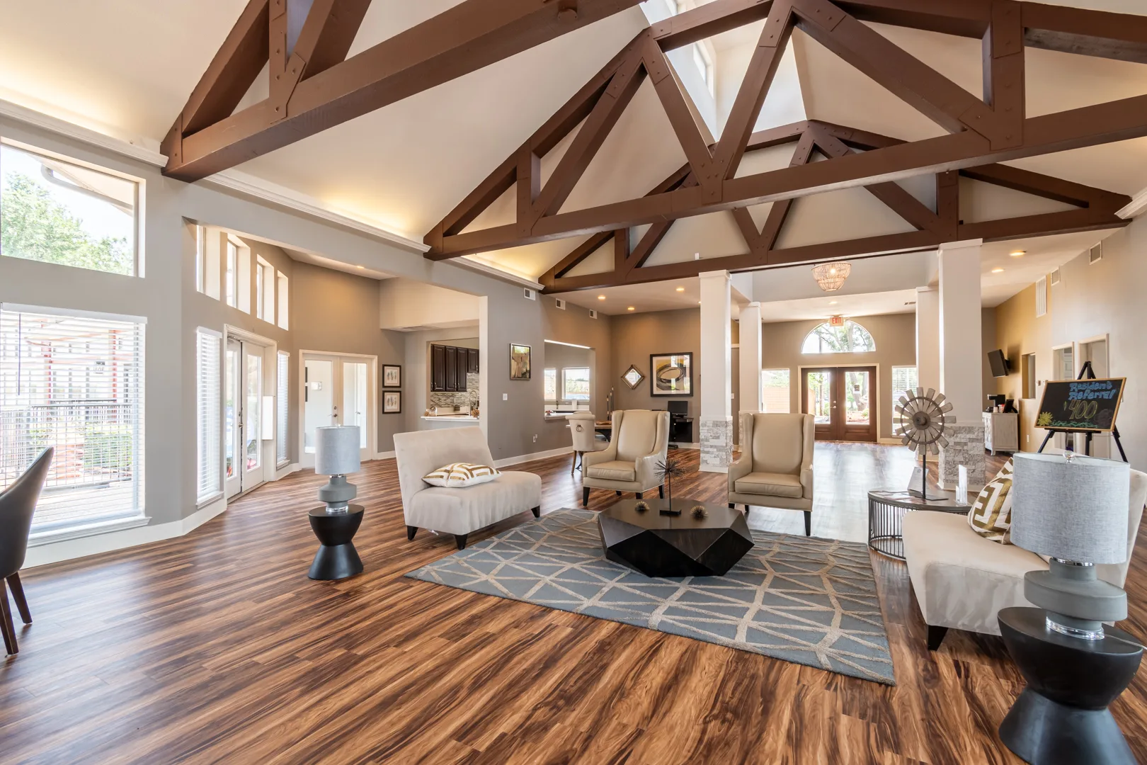 Resident clubhouse lounge with comfortable seating at Western Station at Fossil Creek in Fort Worth, Texas