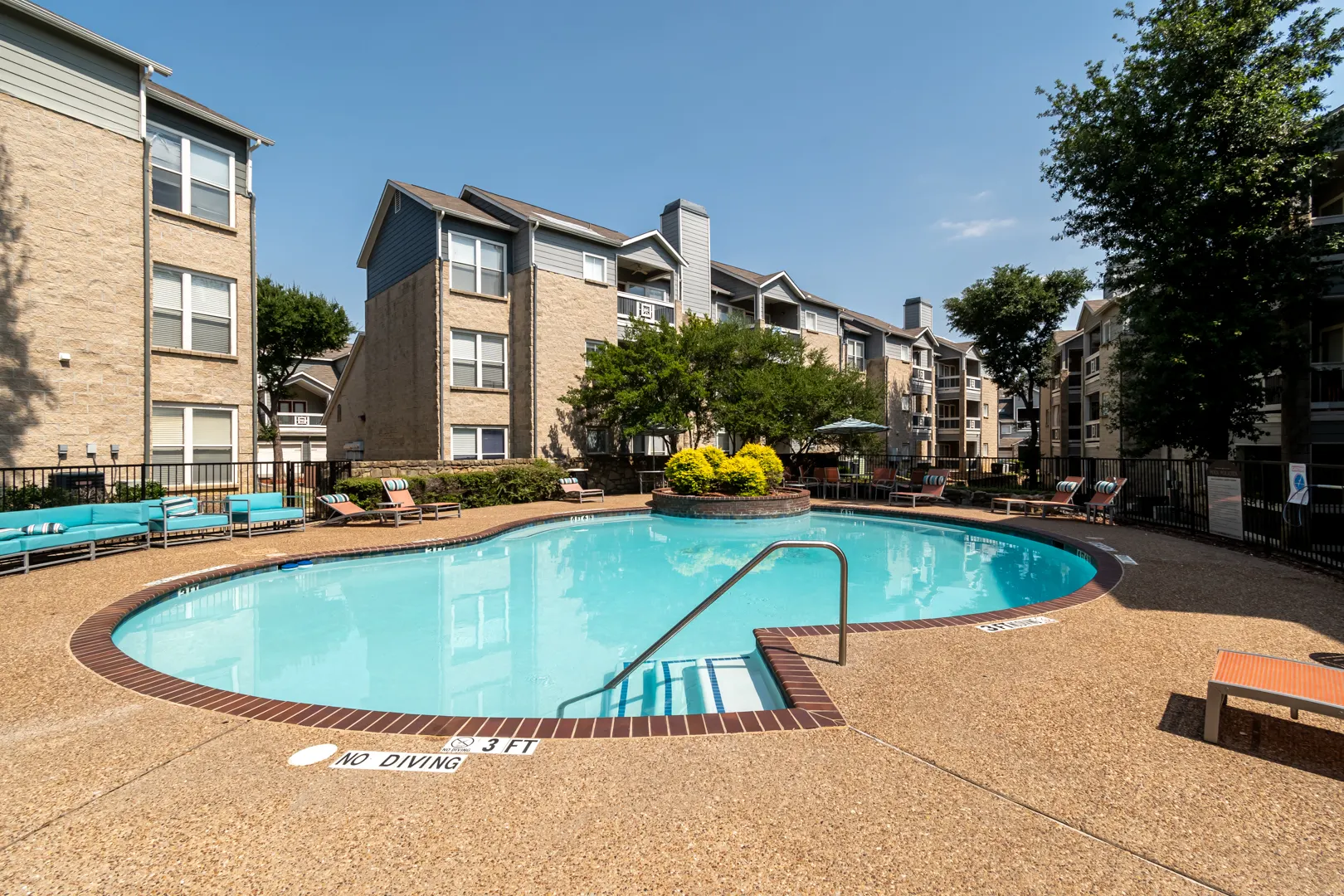 Resort-style swimming pool and sundeck at Western Station at Fossil Creek in Fort Worth, Texas