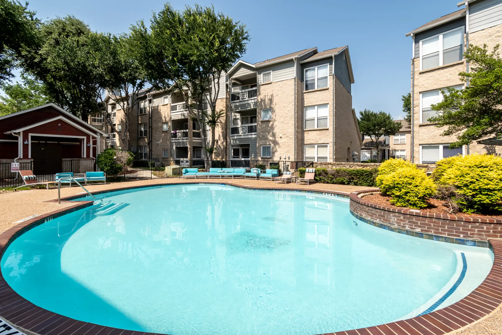 Swimming pool and courtyard view at Western Station at Fossil Creek in Fort Worth, Texas