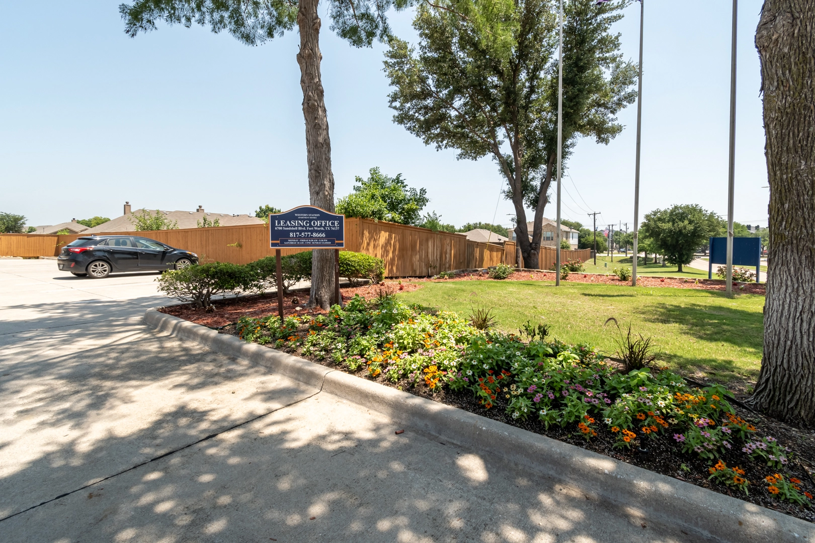 Landscaped grounds and entrance drive at Western Station at Fossil Creek in North Fort Worth, Texas