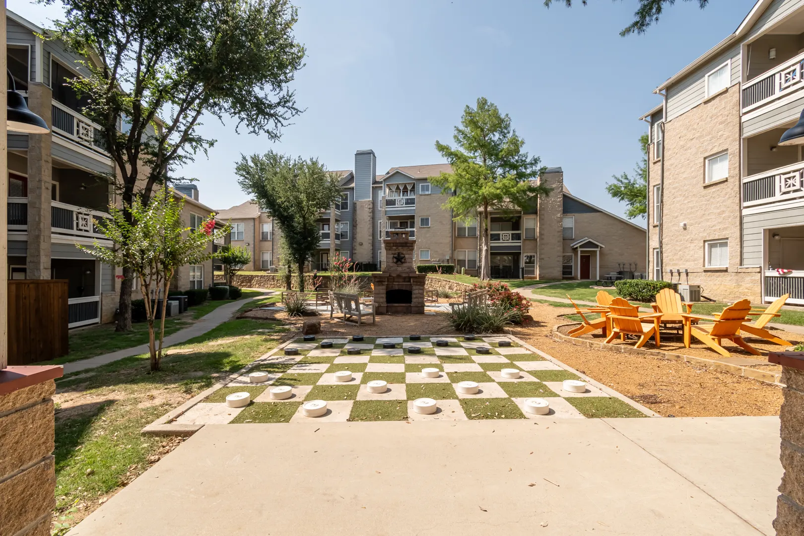 Courtyard games and gathering lawn at Western Station at Fossil Creek in Fort Worth, Texas