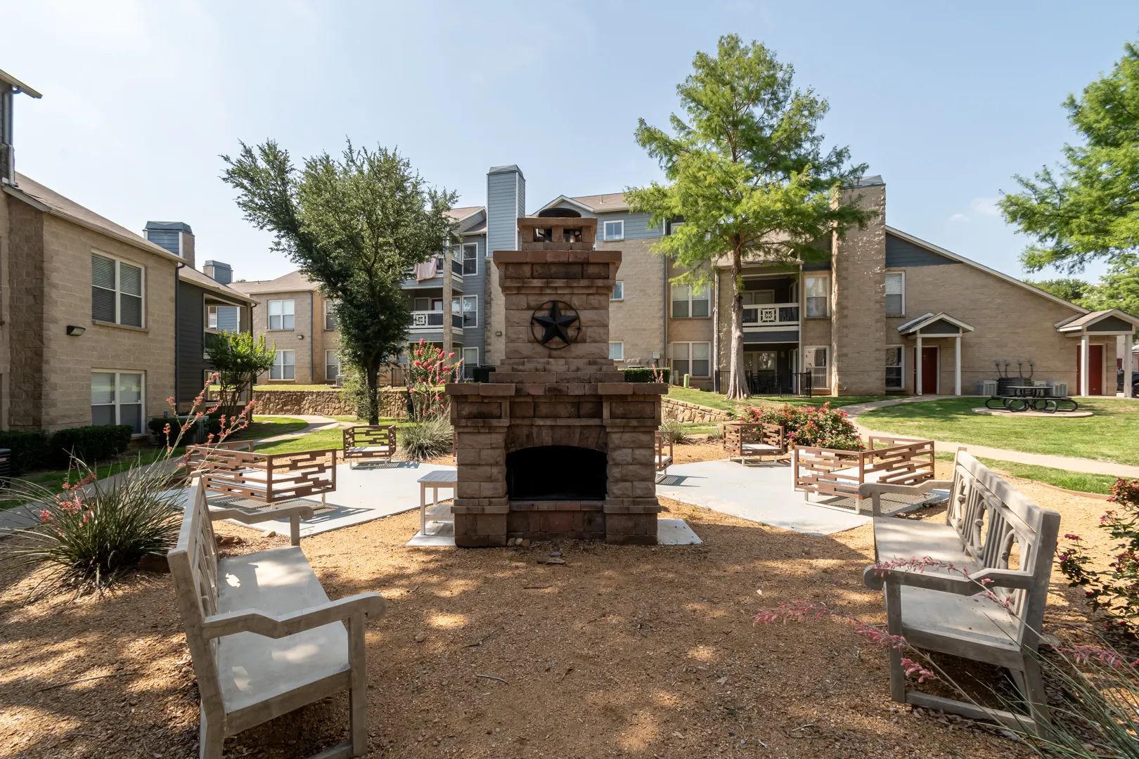 Courtyard fireplace and seating plaza at Western Station at Fossil Creek in Fort Worth, Texas