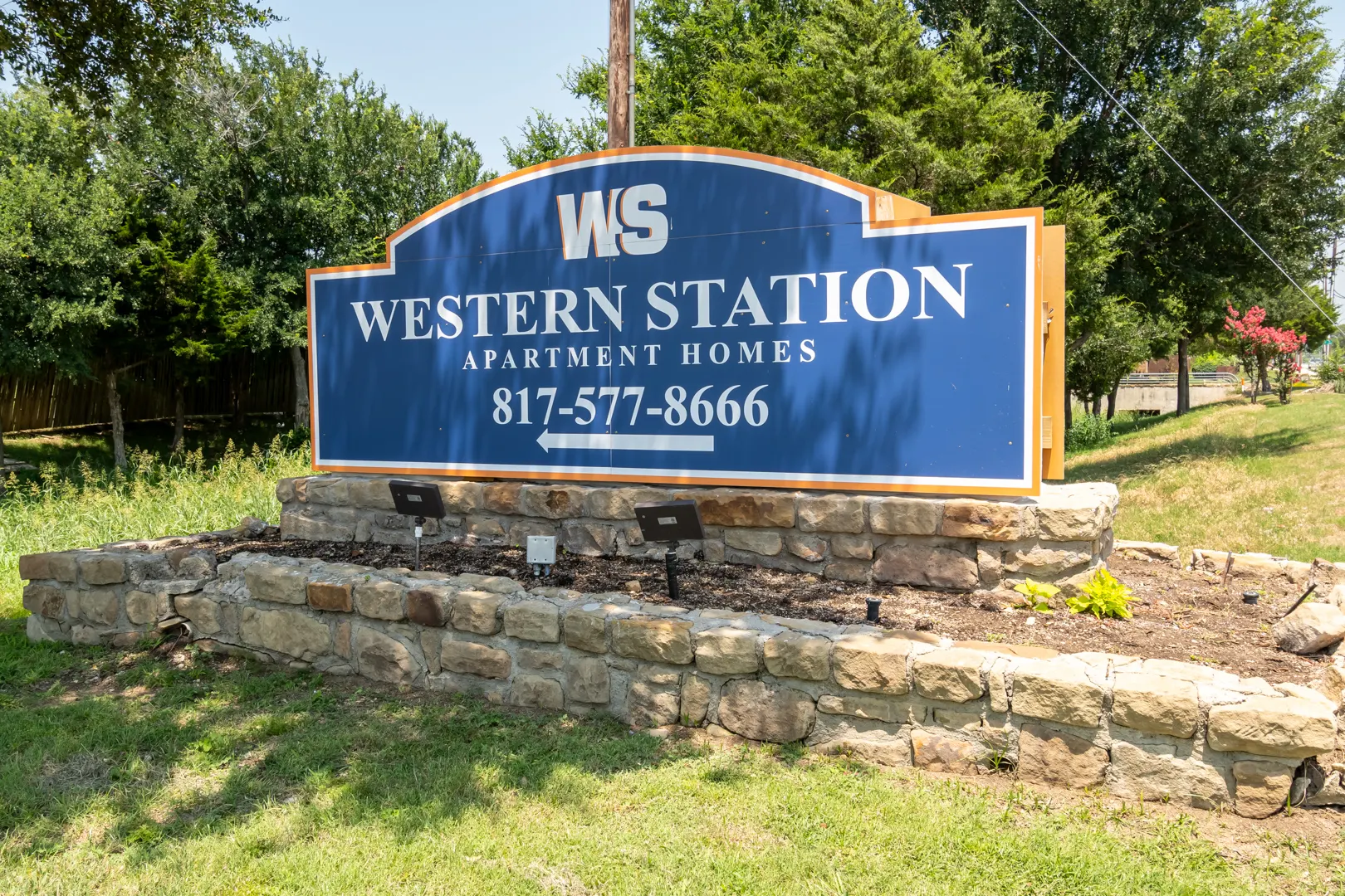 Main monument entrance sign at Western Station at Fossil Creek in Fort Worth, Texas